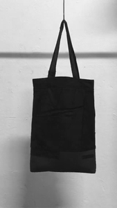 A usefull black shoulder bag out of material mix with raw-edges and a patched pocket in the front. It is made in Berlin German.        Size: 32cm x 42cm x 11cm Colour: black Material: overgarment 60% cotton, 10%wool, 5% spandex, 5%PE,                                     20% fake leather                          lining 100% PE